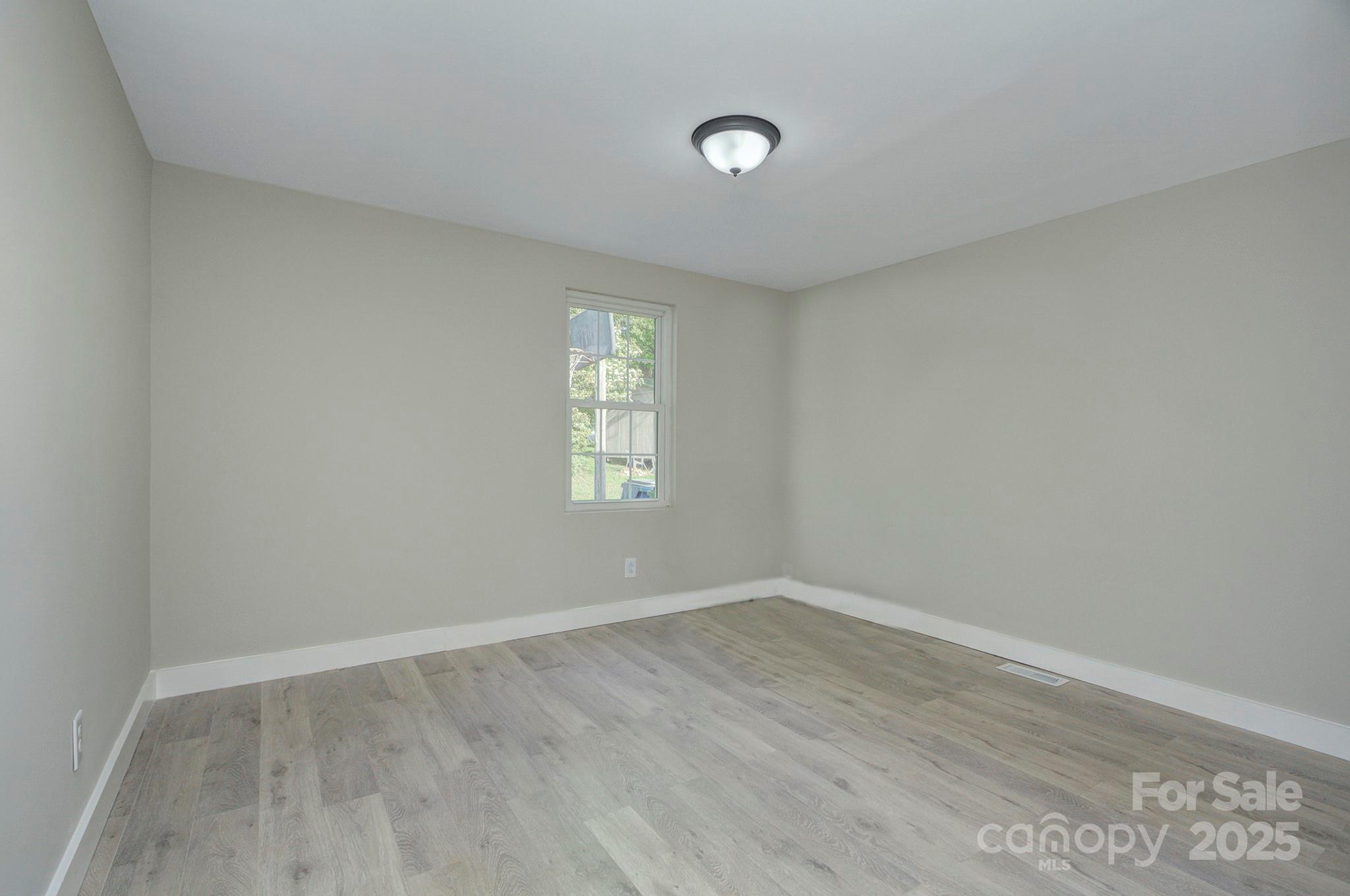 103 Moore Avenue Mount Holly, NC 28120 - Photo 16 of 21 an empty room with a window