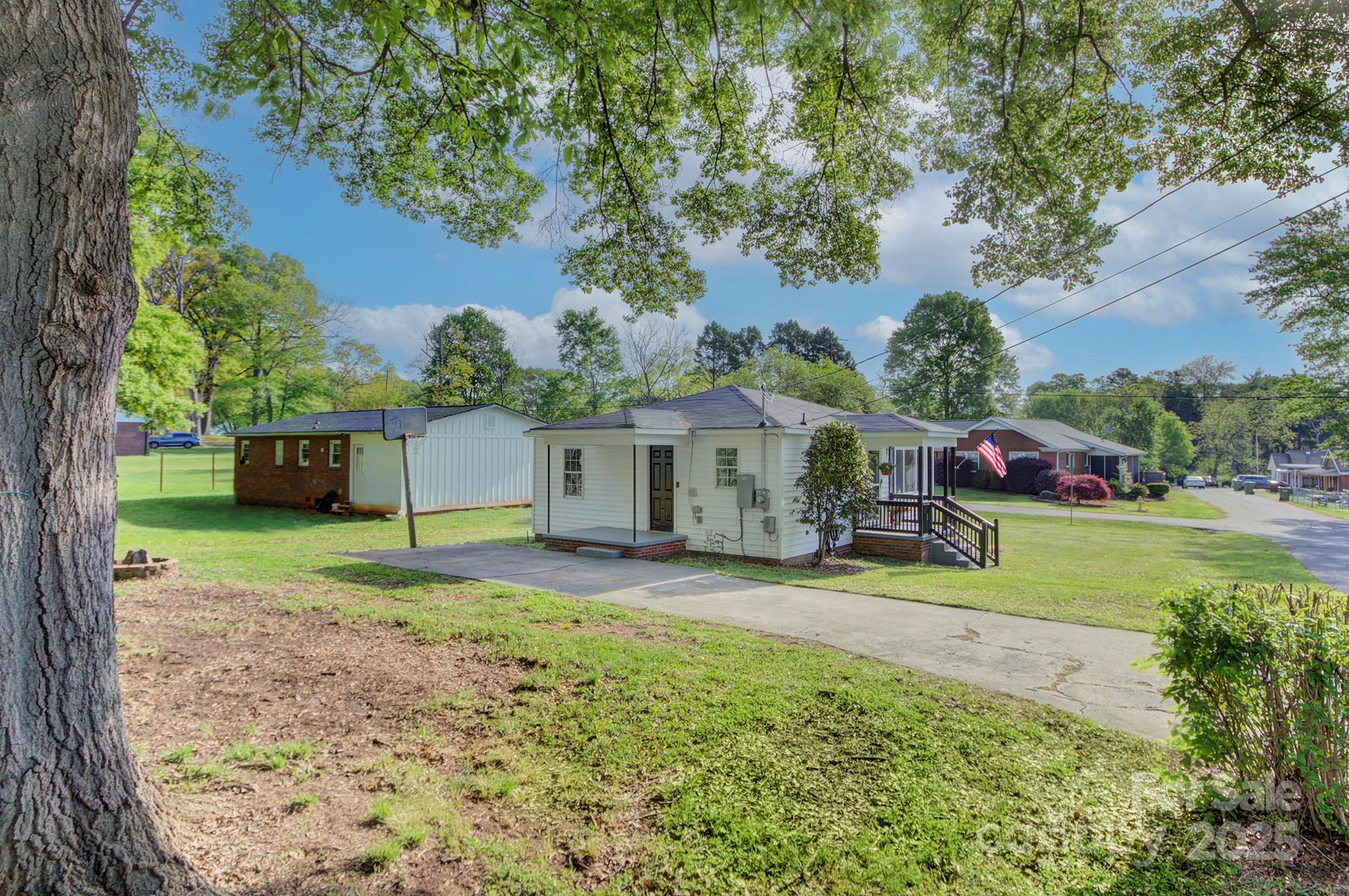 103 Moore Avenue Mount Holly, NC 28120 - Photo 19 of 21 a view of a house with backyard and garden