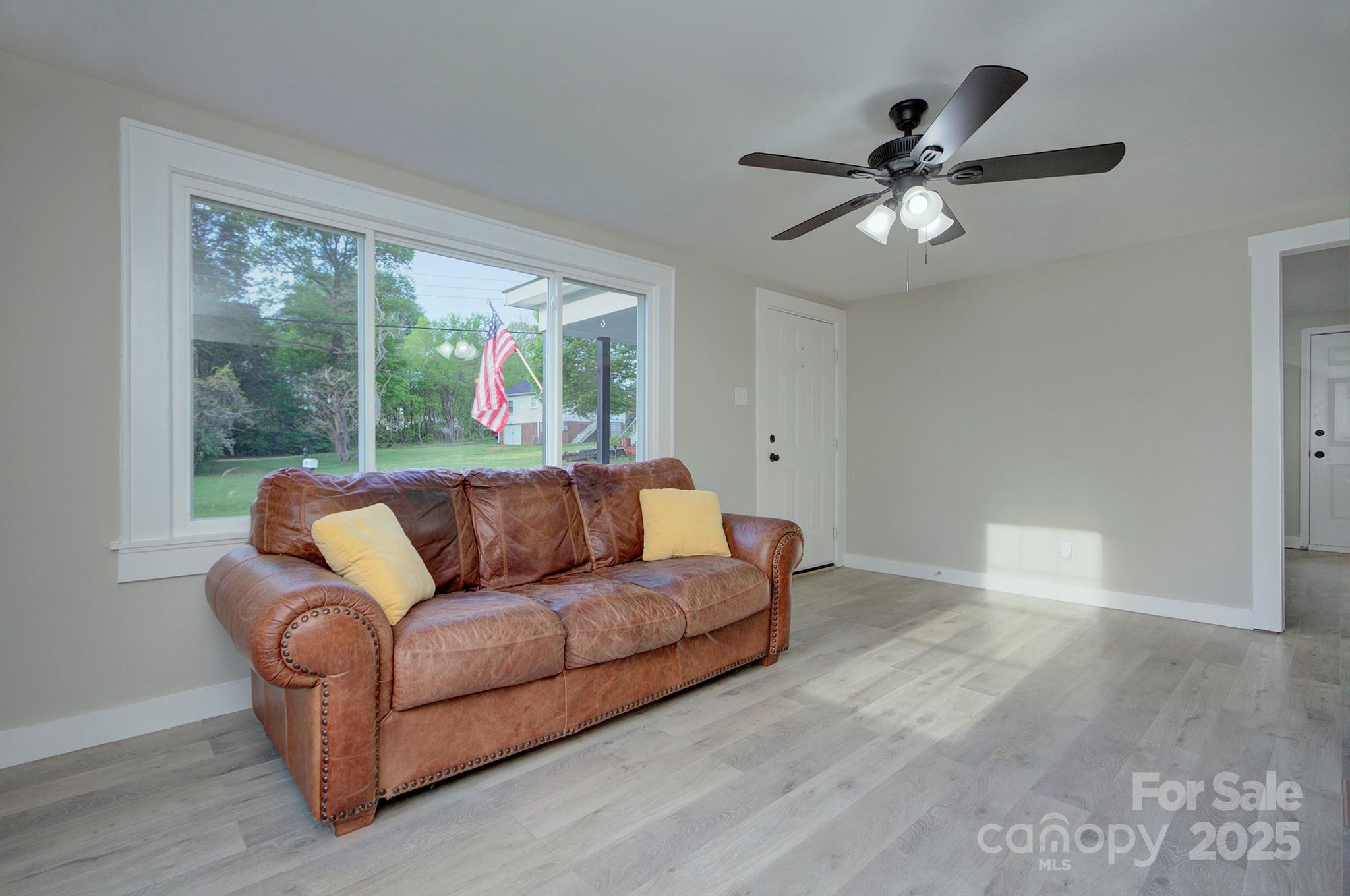 103 Moore Avenue Mount Holly, NC 28120 - Photo 4 of 21 a living room with furniture and a large window