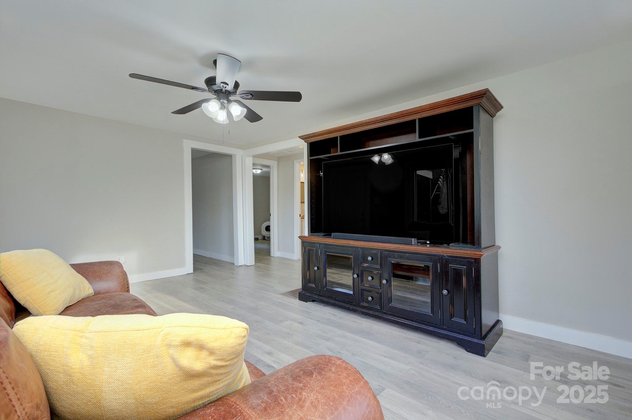 103 Moore Avenue Mount Holly, NC 28120 - Photo 5 of 21 a living room with furniture and a flat screen tv