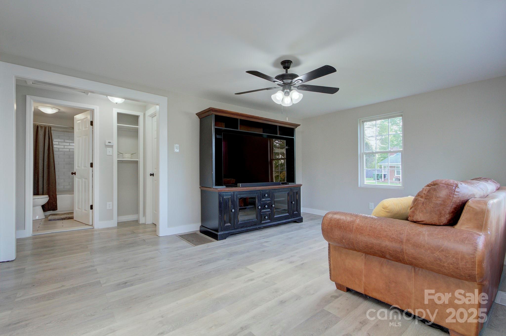 103 Moore Avenue Mount Holly, NC 28120 - Photo 6 of 21 a bedroom with furniture and a flat screen tv
