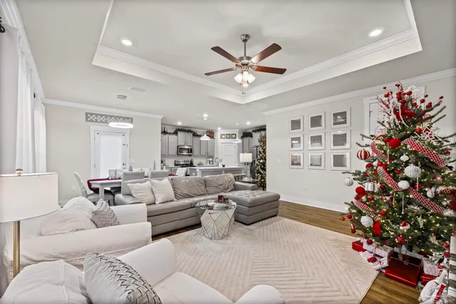 a living room with furniture and flowers