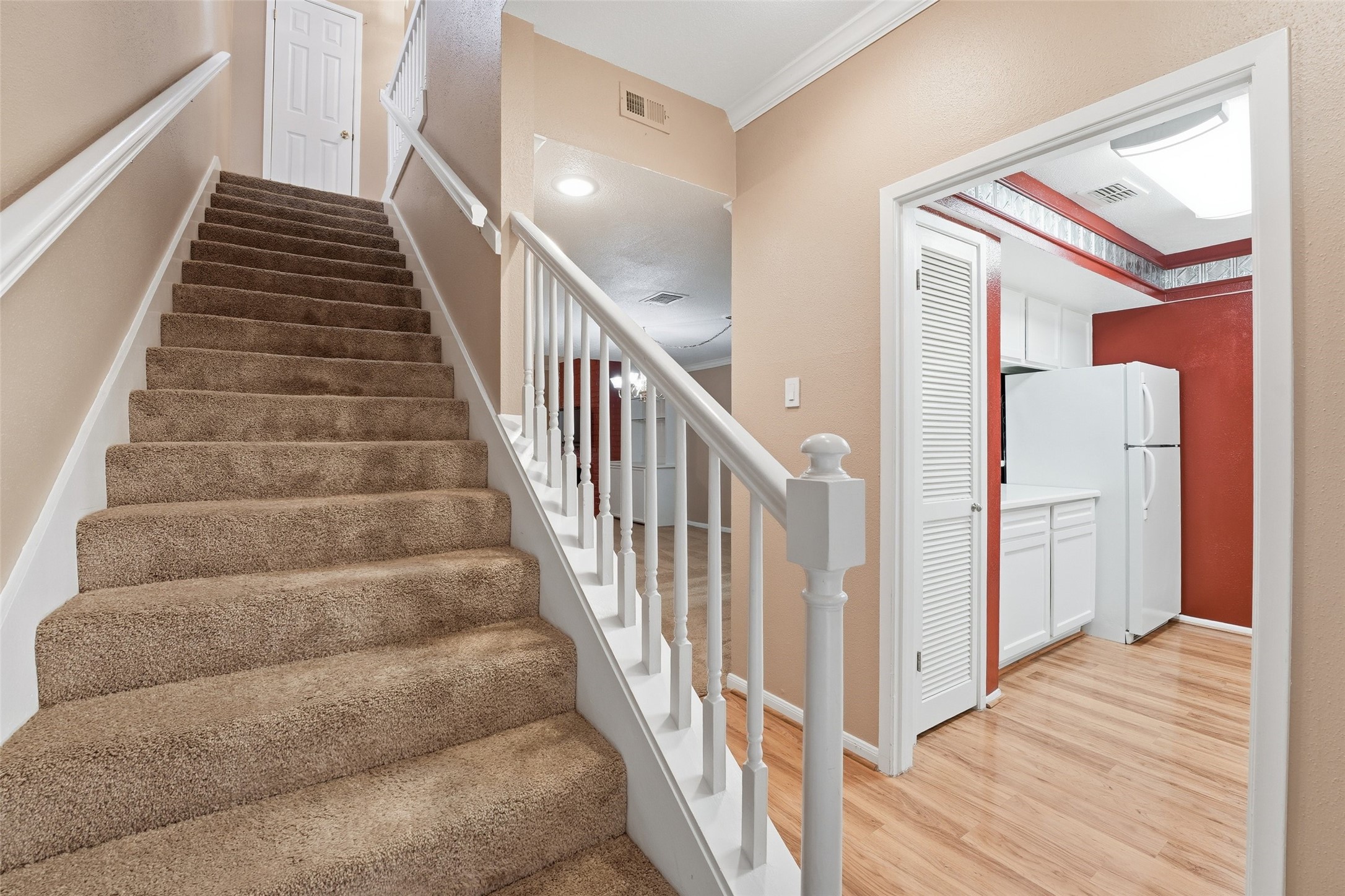 2232 South Piney Point Road, Unit 108 Houston, TX 77063 - Photo 12 of 32 a view of entryway and hall with wooden floor