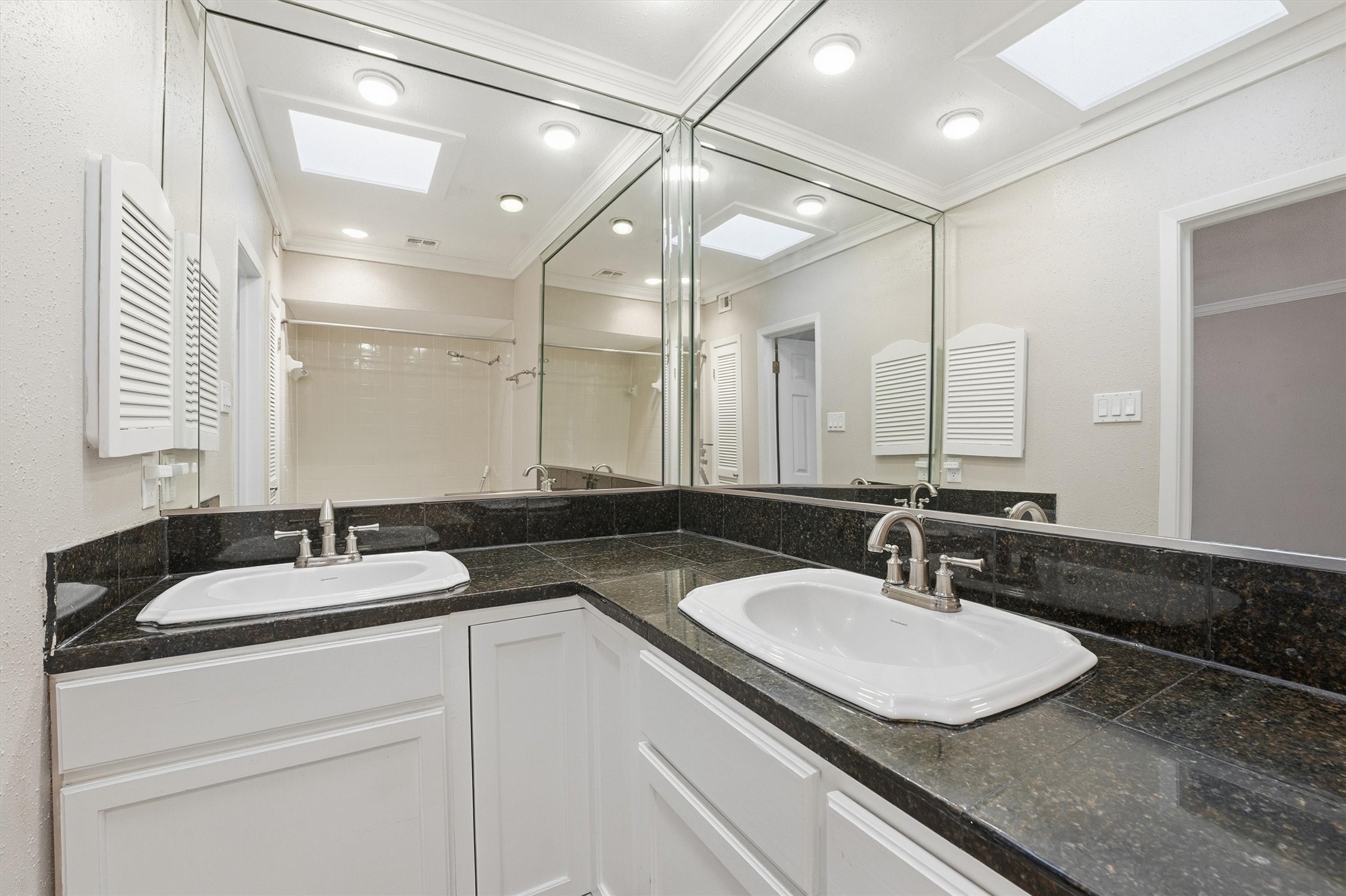 2232 South Piney Point Road, Unit 108 Houston, TX 77063 - Photo 15 of 32 a bathroom with a sink double vanity and a mirror