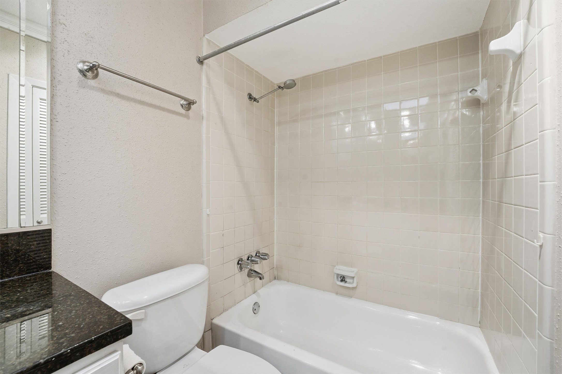 2232 South Piney Point Road, Unit 108 Houston, TX 77063 - Photo 16 of 32 a bathroom with a bathtub and a toilet
