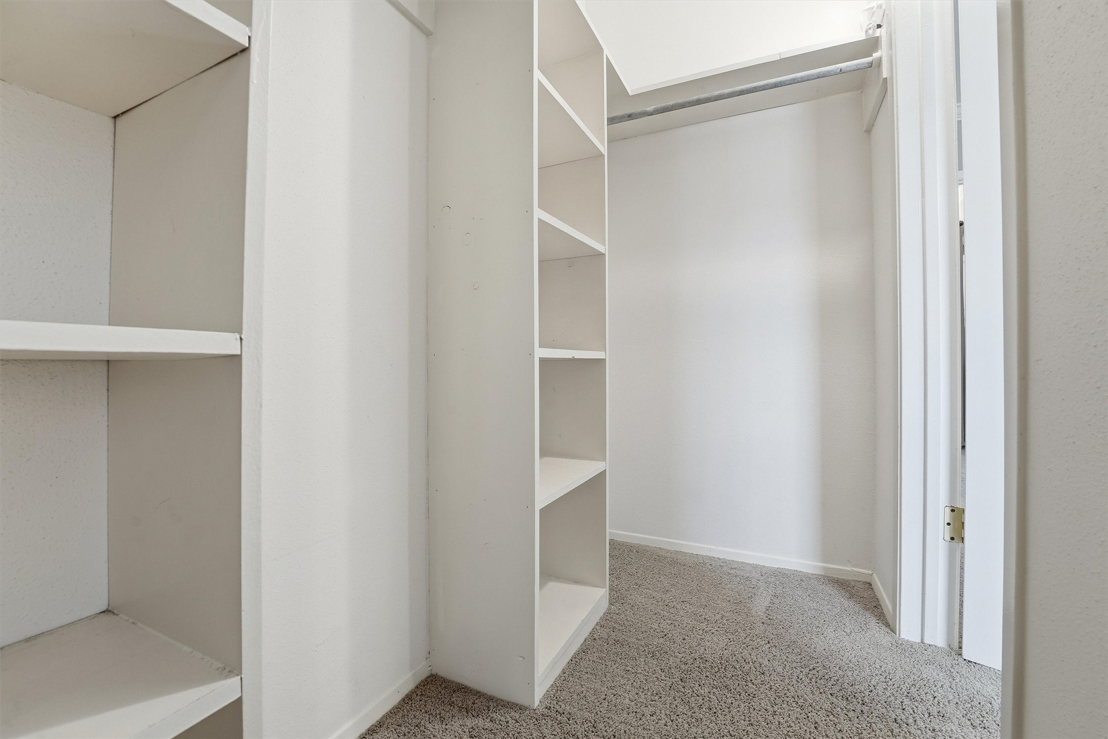 2232 South Piney Point Road, Unit 108 Houston, TX 77063 - Photo 18 of 32 a view of an empty walk in closet