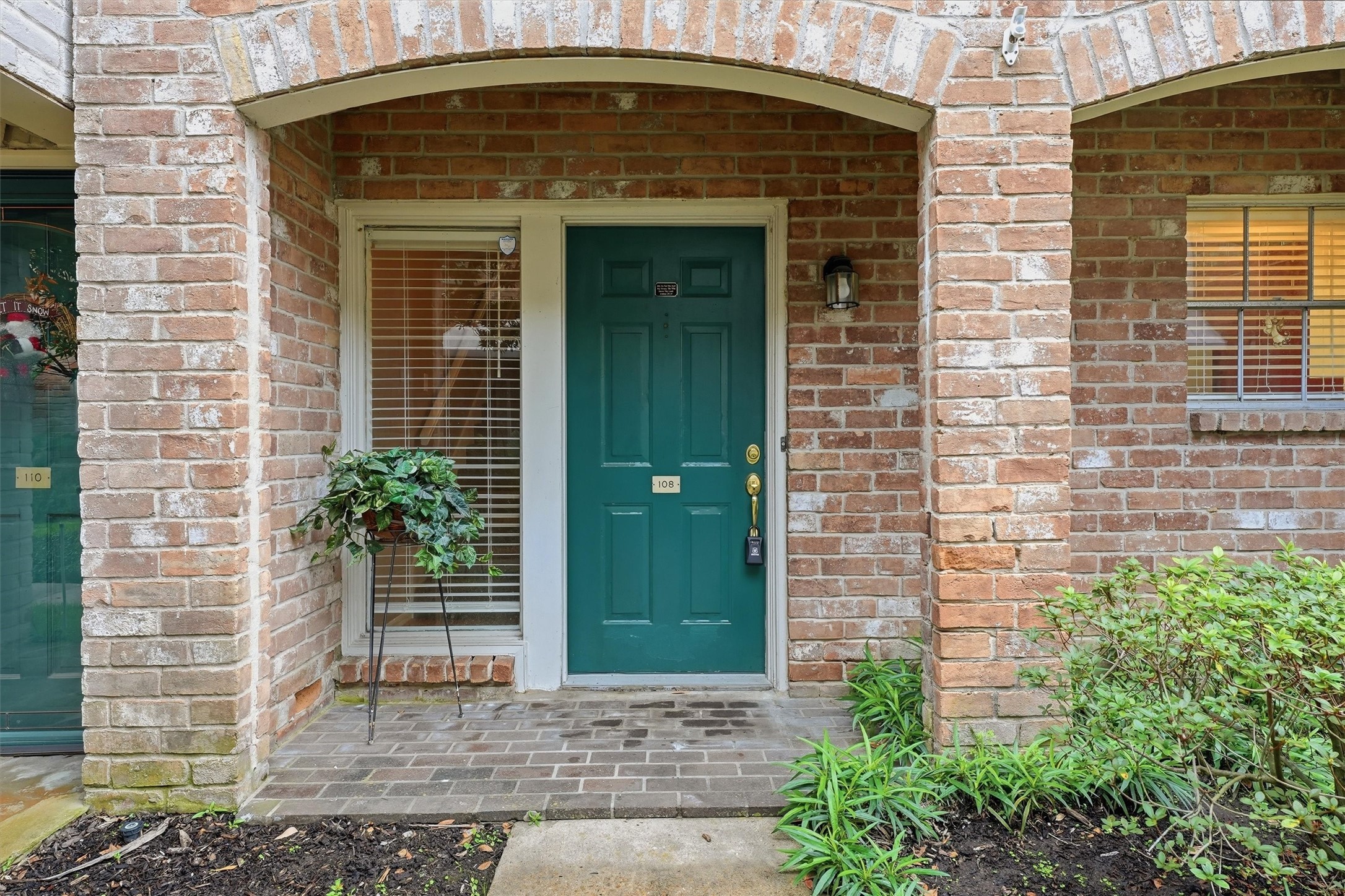 2232 South Piney Point Road, Unit 108 Houston, TX 77063 - Photo 2 of 32 a front view of a house with plants