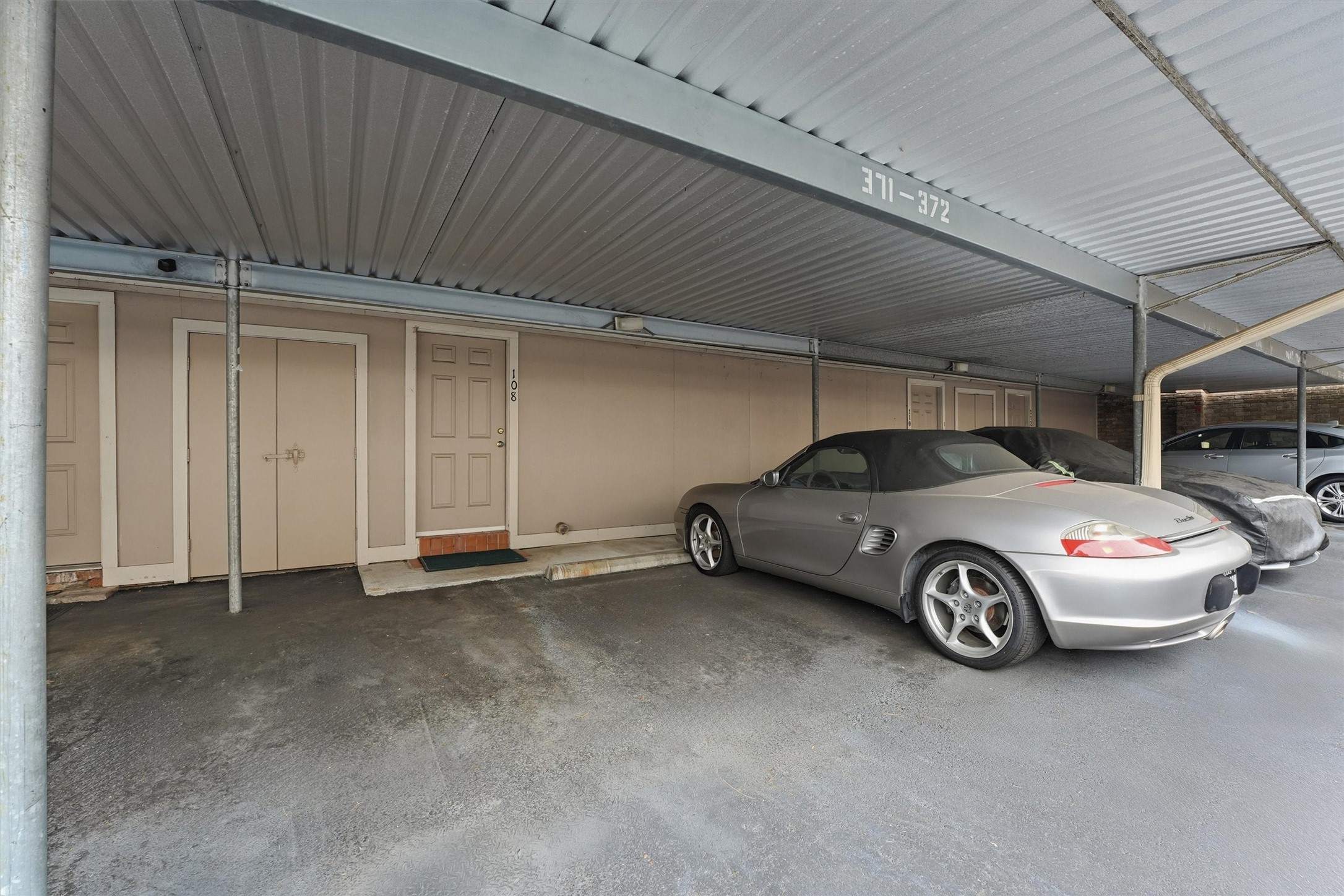 2232 South Piney Point Road, Unit 108 Houston, TX 77063 - Photo 25 of 32 a car parked in garage