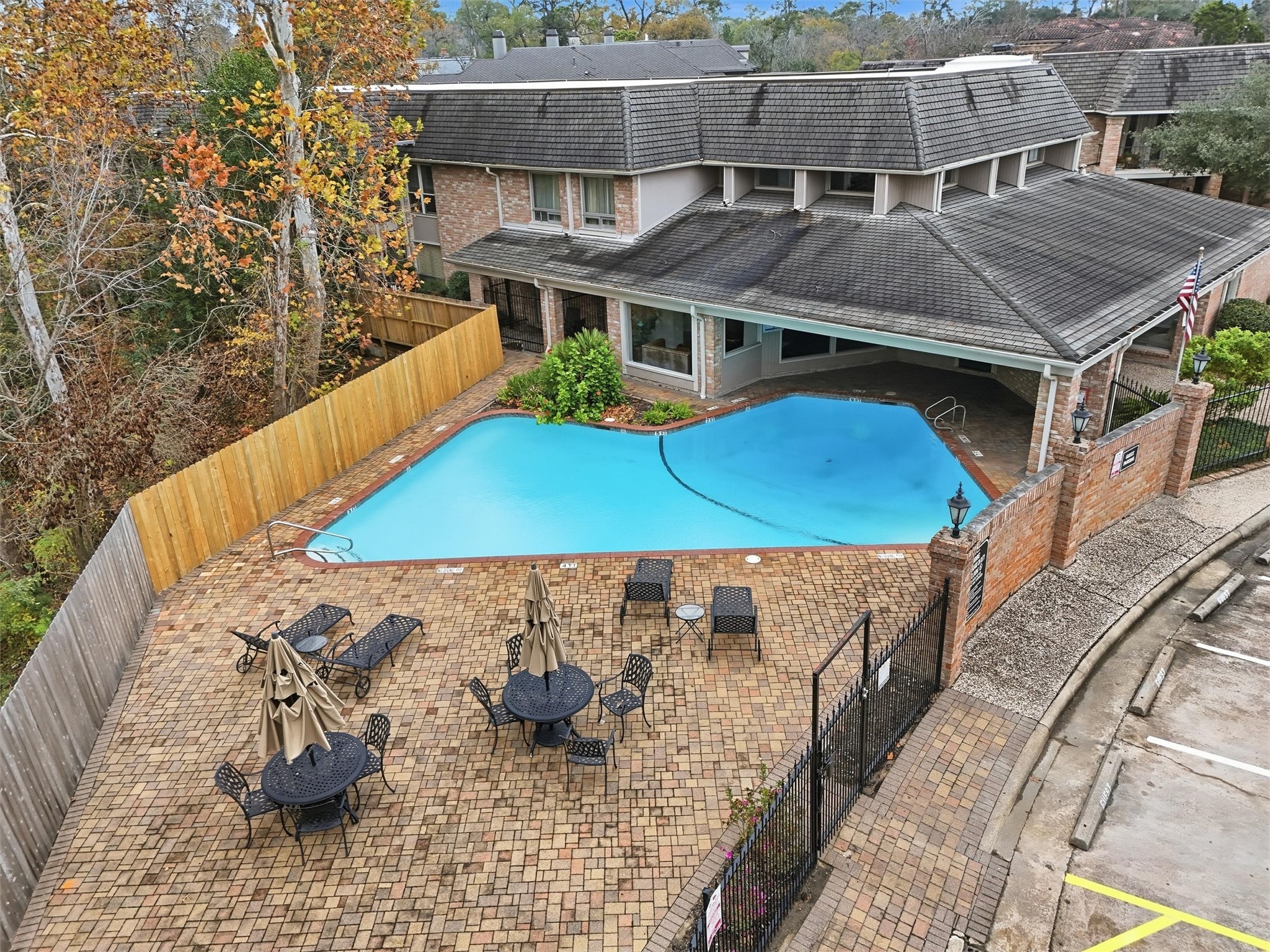 2232 South Piney Point Road, Unit 108 Houston, TX 77063 - Photo 26 of 32 an aerial view of a house with large trees