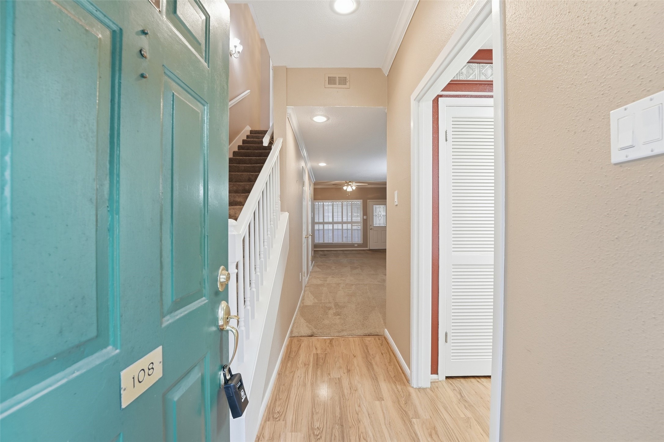 2232 South Piney Point Road, Unit 108 Houston, TX 77063 - Photo 3 of 32 a view of a hallway with wooden floor