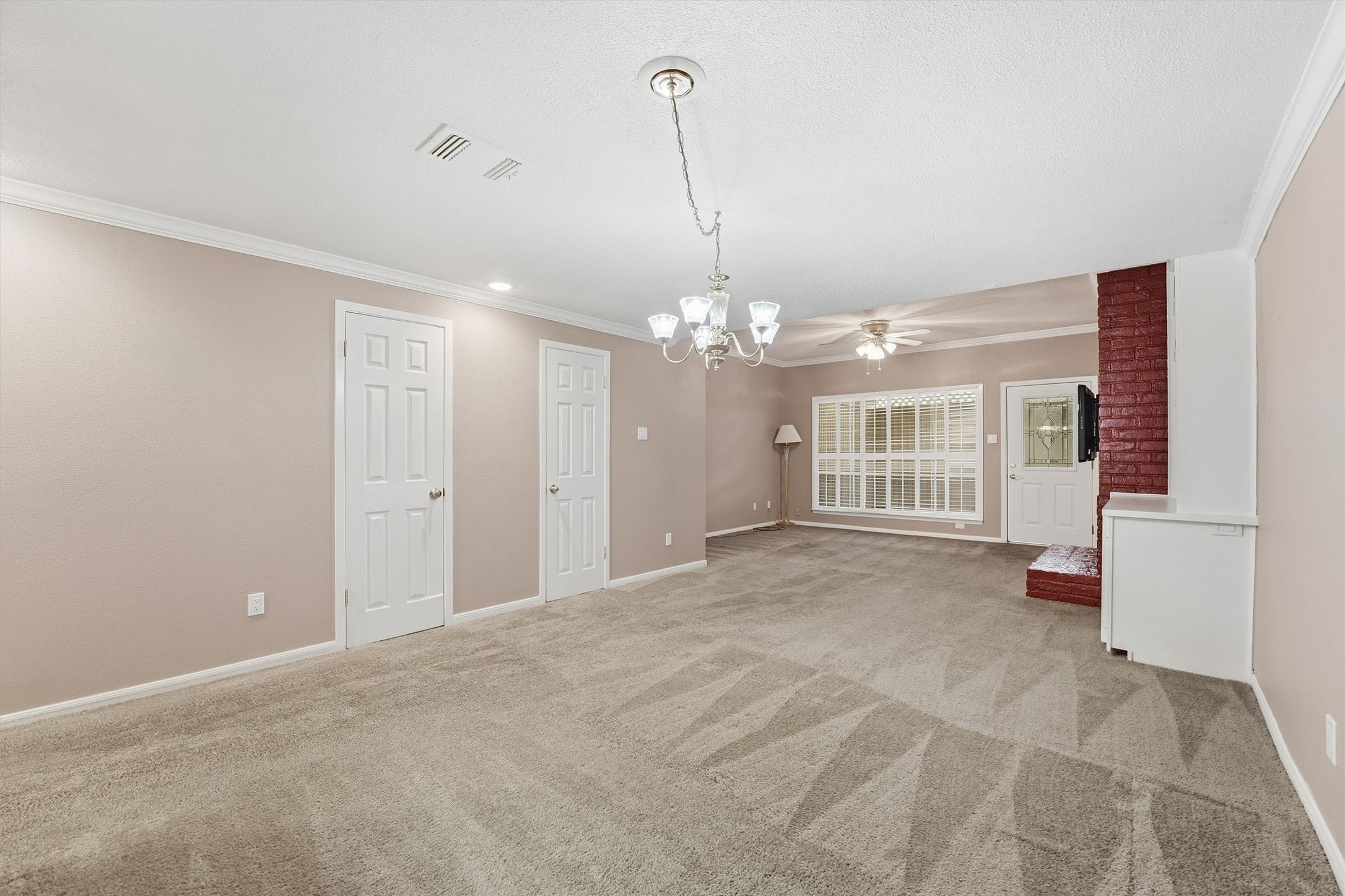 2232 South Piney Point Road, Unit 108 Houston, TX 77063 - Photo 9 of 32 a view of a room with a chandelier
