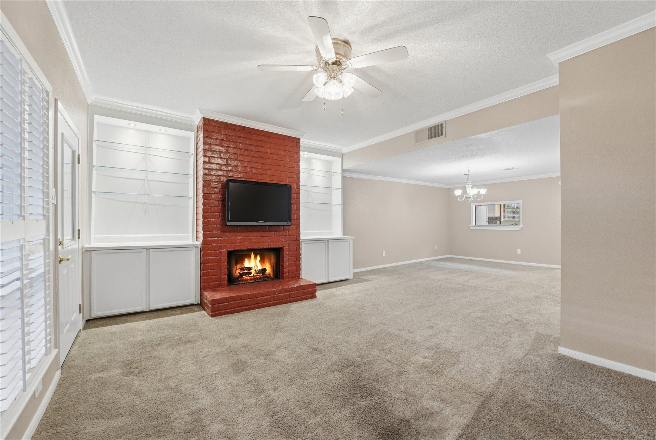 2232 South Piney Point Road, Unit 108 Houston, TX 77063 - Photo 10 of 32 wooden floor in an empty room with a fireplace