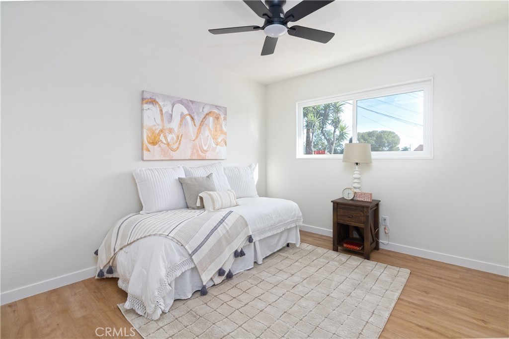 3306 Debbie Lane Riverside, CA 92501 - Photo 17 of 32 a bedroom with bed and a window