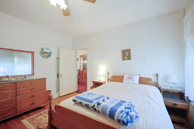 a bedroom with a bed and a dresser