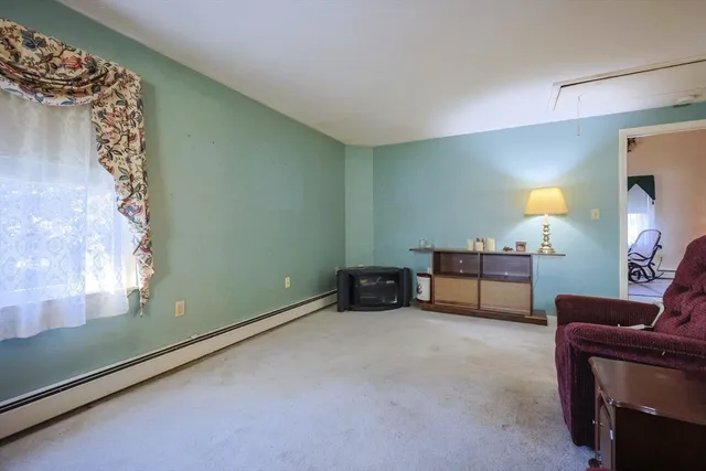 a room with furniture and a lamp