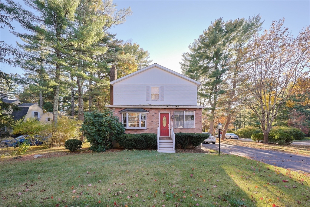 587 Common Street Walpole, MA 02081 - Photo 3 of 38 a view of house with outdoor space