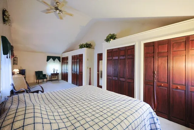 a bed room with a bed and a mirror