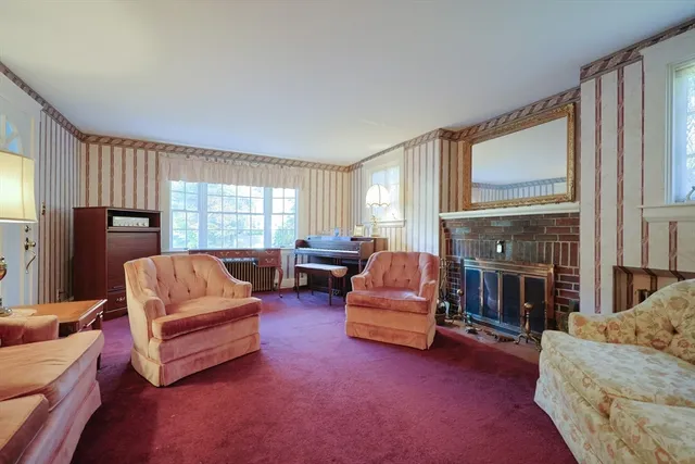 a living room with furniture fireplace and flat screen tv