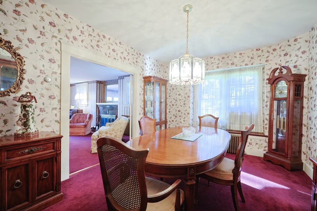 587 Common Street Walpole, MA 02081 - Photo 9 of 38 a view of a dining room with furniture window and wooden floor
