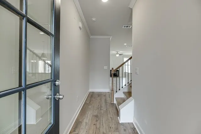 a kitchen with stainless steel appliances granite countertop a sink a stove and a wooden floors
