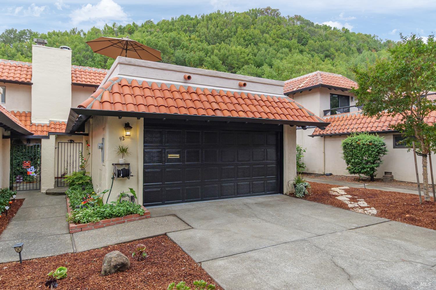 a front view of a house with a garage