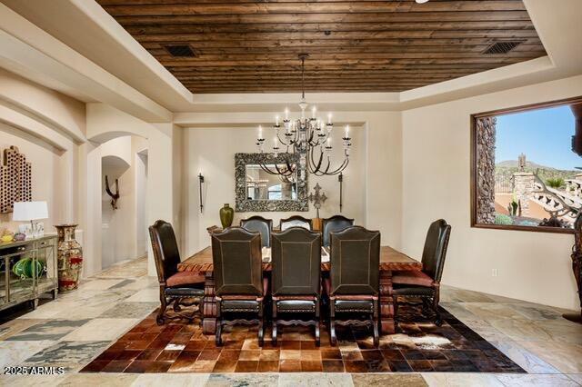 39601 North Ocotillo Ridge Drive Carefree, AZ 85377 - Photo 19 of 81 a view of a dining room with furniture and a chandelier