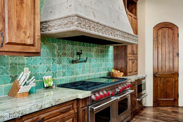 39601 North Ocotillo Ridge Drive Carefree, AZ 85377 - Photo 22 of 81 a kitchen with a stove and a wooden floor