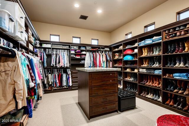 39601 North Ocotillo Ridge Drive Carefree, AZ 85377 - Photo 32 of 81 a view of walk in closet with clothes and shoes