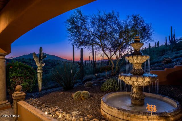 39601 North Ocotillo Ridge Drive Carefree, AZ 85377 - Photo 69 of 81 a view of a fountain in the backyard of a house