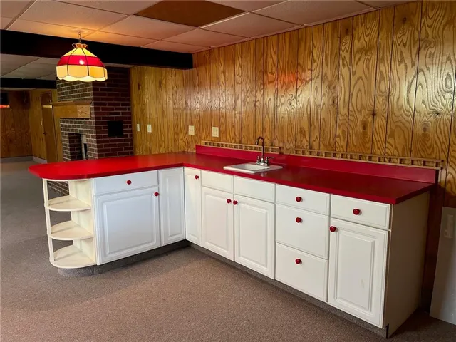a view of a kitchen with microwave and cabinets