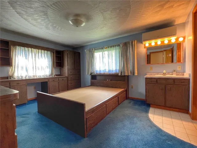 a bed room with a bed and window