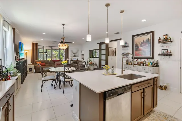 a view of a hallway with workspace and a window