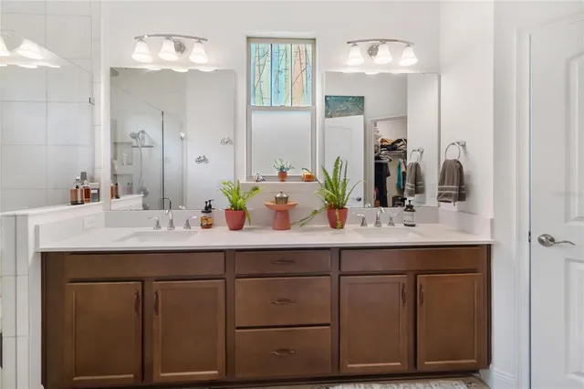 a dining room with furniture and a floor to ceiling window