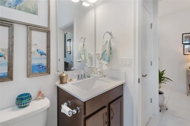 a large kitchen with granite countertop a large counter top appliances and cabinets