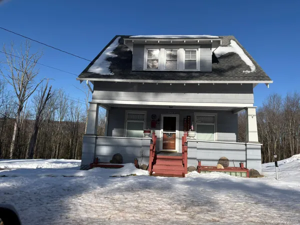 a front view of a house with roof deck