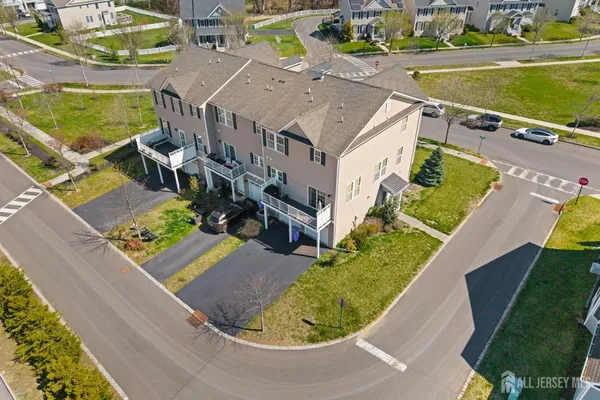 an aerial view of a house with a ocean view