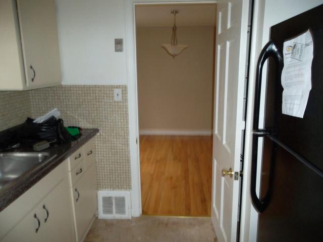 8118 West 26th Street North Riverside, IL 60546 - Photo 8 of 10 a kitchen with a refrigerator and cabinets