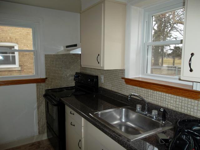 8118 West 26th Street North Riverside, IL 60546 - Photo 9 of 10 a kitchen that has a sink and a window