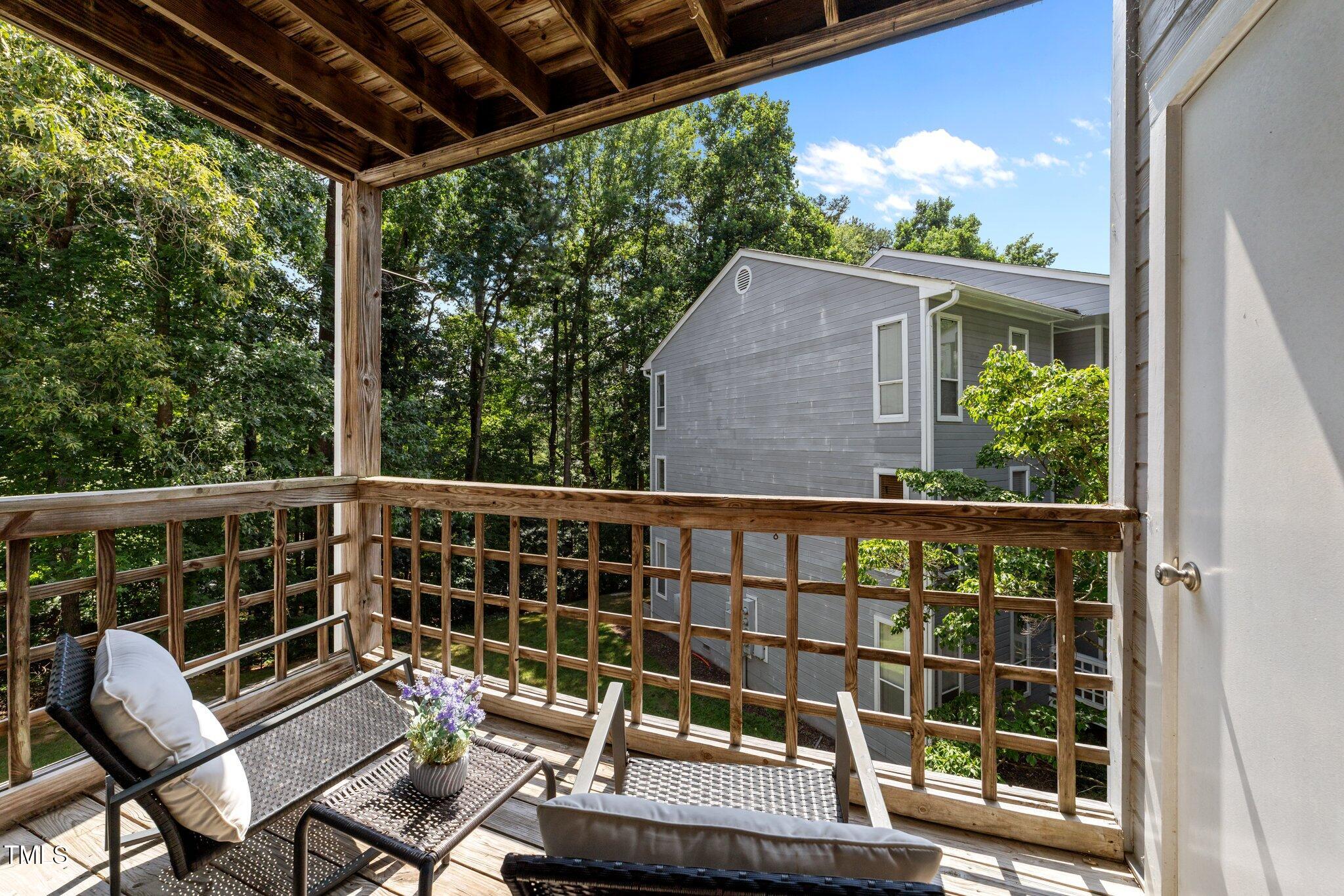 4611 Timbermill Court, Unit 201 Raleigh, NC 27612 - Photo 14 of 32 a view of a chair and tables in the balcony