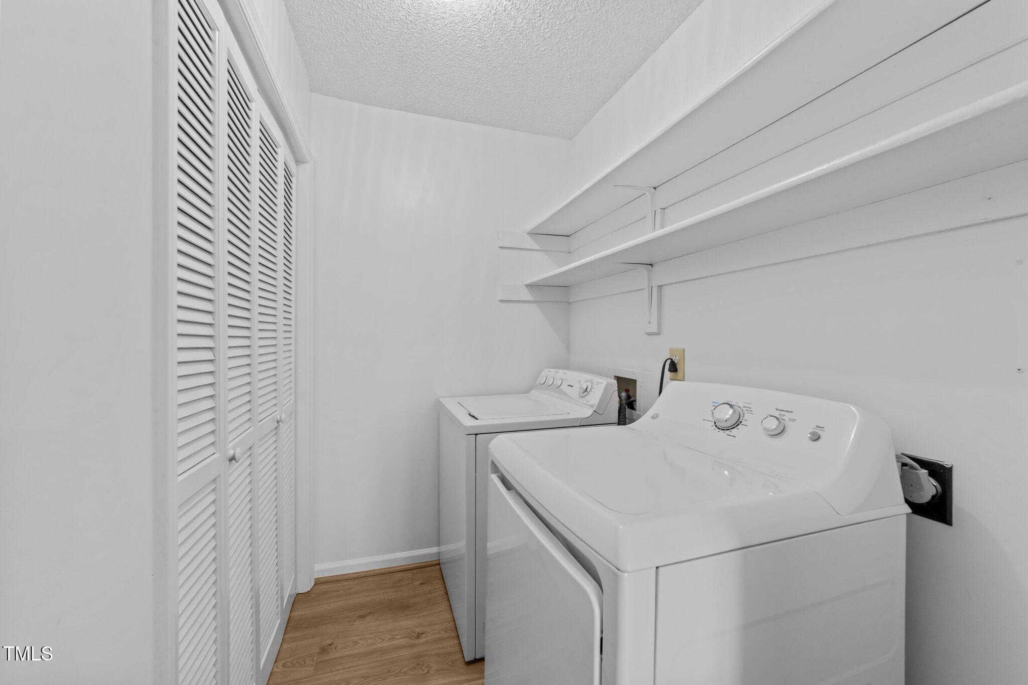 4611 Timbermill Court, Unit 201 Raleigh, NC 27612 - Photo 17 of 32 a utility room with dryer and washer