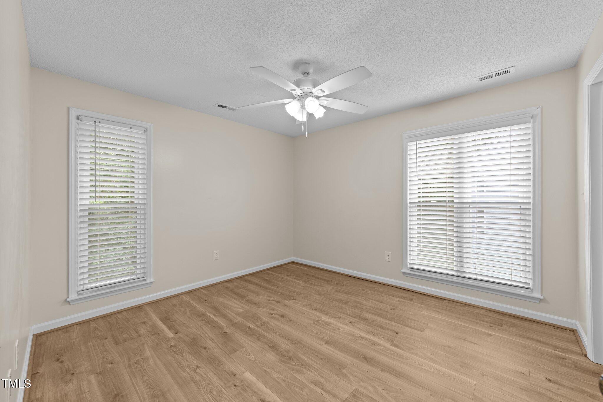 4611 Timbermill Court, Unit 201 Raleigh, NC 27612 - Photo 19 of 32 a view of an empty room with a window