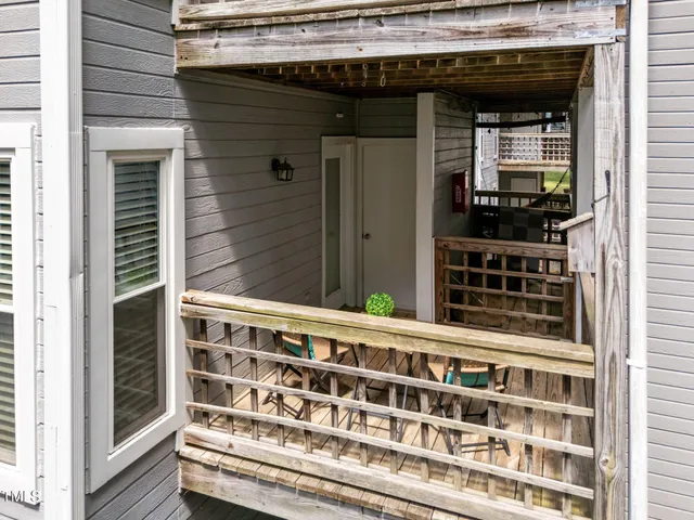 a view of a house with a door and wooden floor