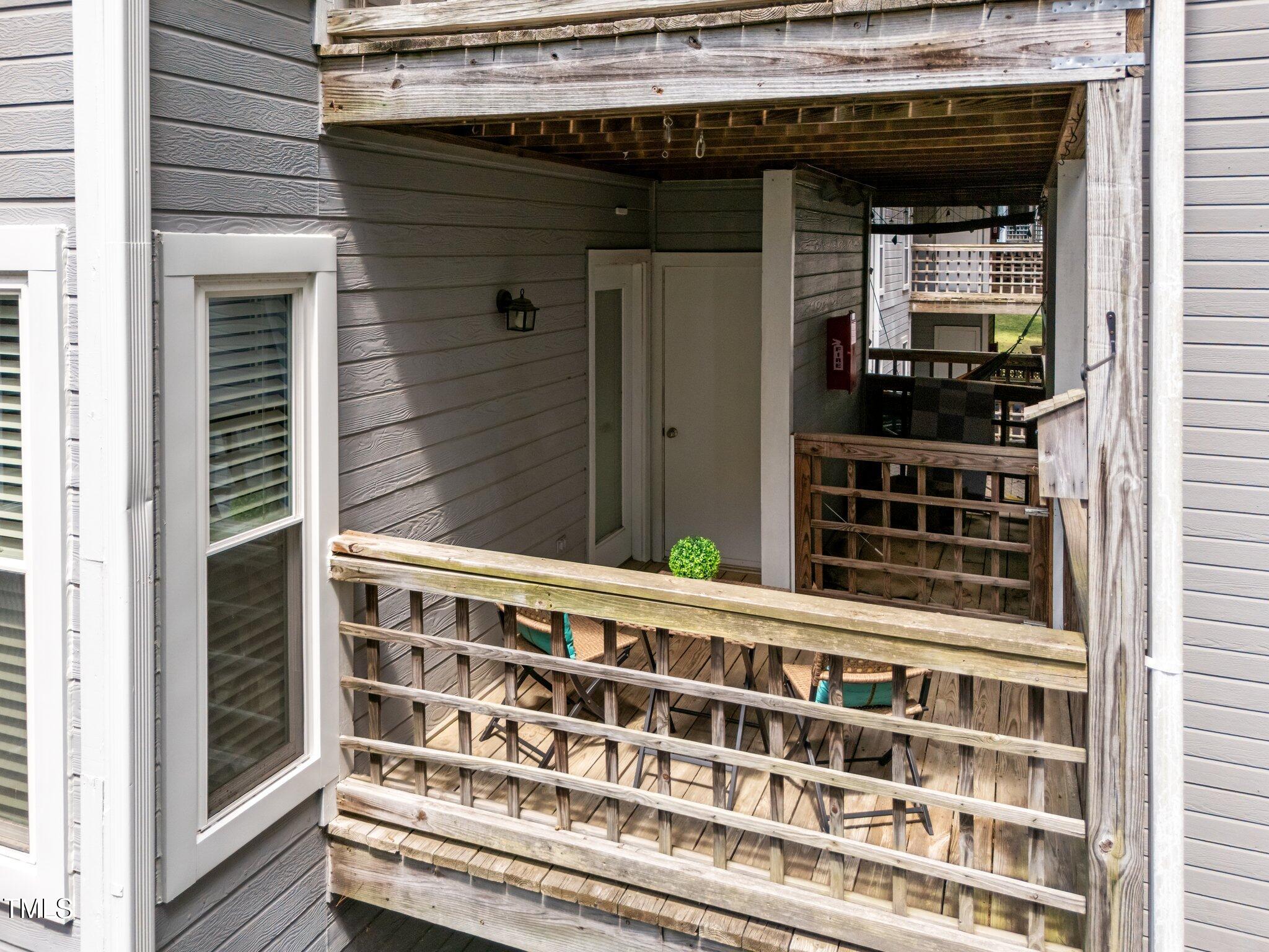 4611 Timbermill Court, Unit 201 Raleigh, NC 27612 - Photo 27 of 32 a view of a wooden door and a window
