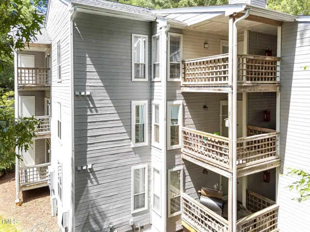 an aerial view of residential house with pool garden and entryway