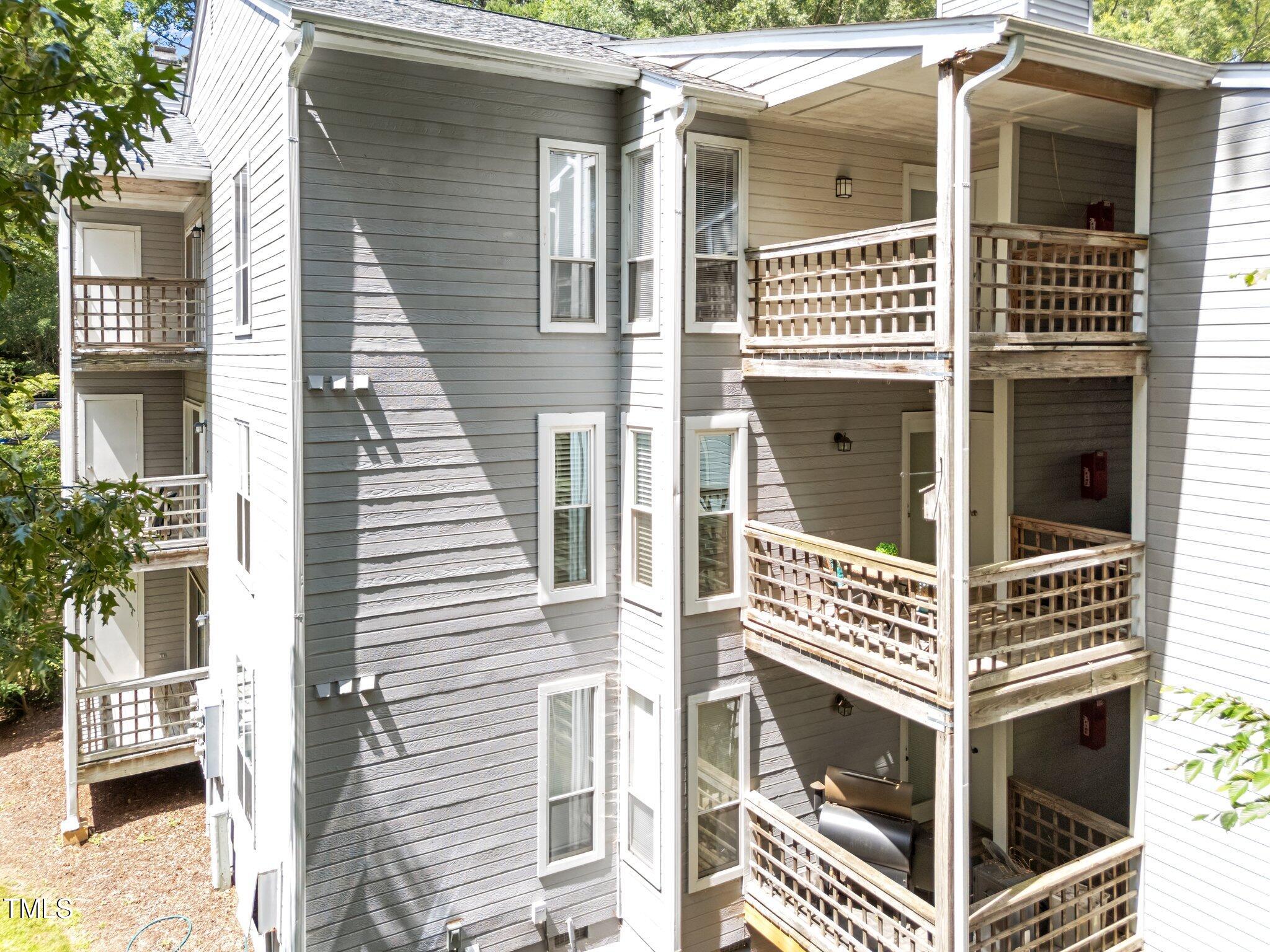 4611 Timbermill Court, Unit 201 Raleigh, NC 27612 - Photo 28 of 32 a view of a house with a door and wooden floor