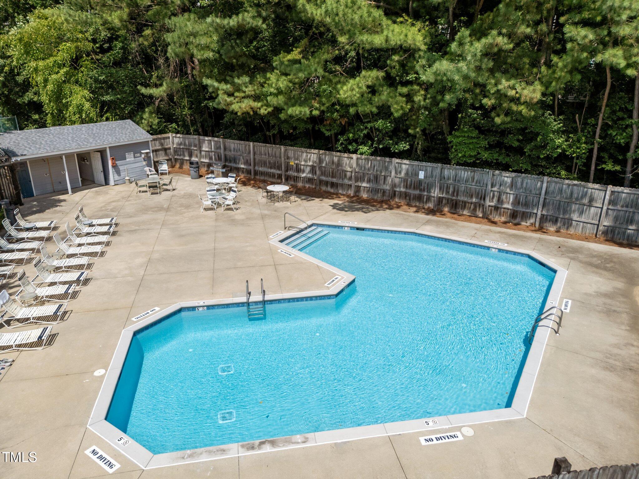 4611 Timbermill Court, Unit 201 Raleigh, NC 27612 - Photo 31 of 32 a view of a swimming pool with a patio