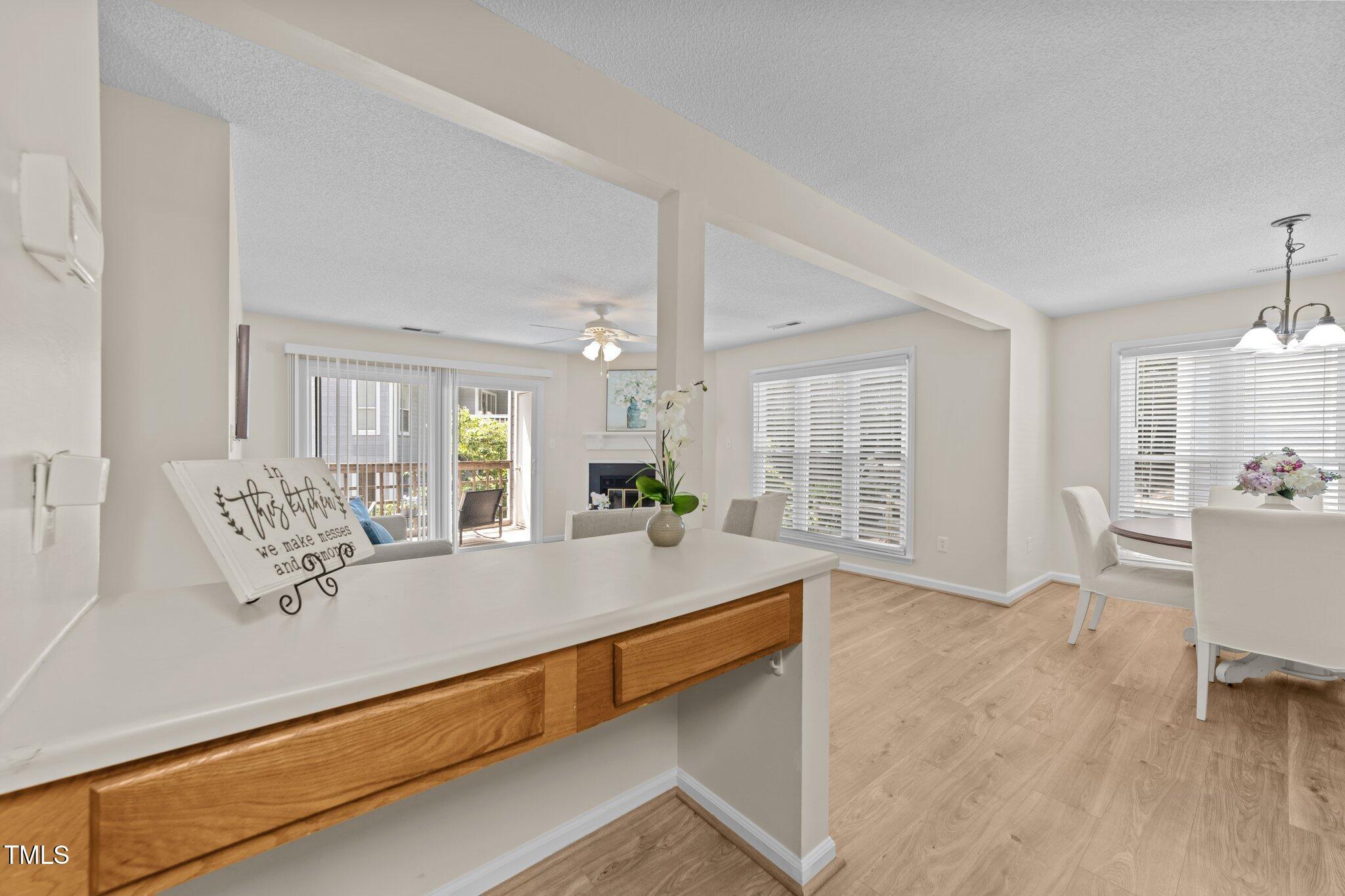4611 Timbermill Court, Unit 201 Raleigh, NC 27612 - Photo 8 of 32 a living room with furniture and wooden floor