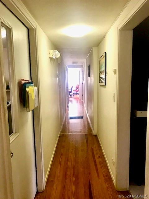 204 Hubbell Street Edgewater, FL 32132 - Photo 3 of 14 a view of a hallway with wooden floor