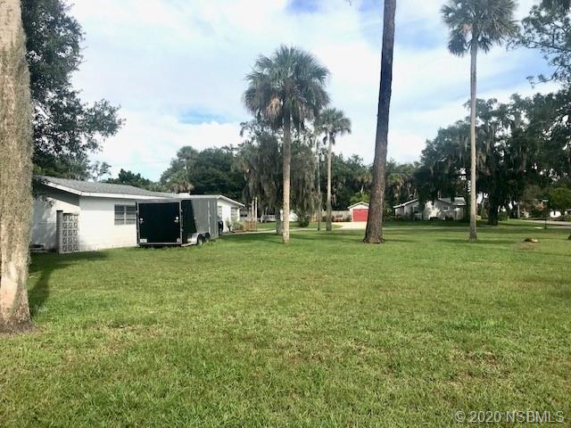 204 Hubbell Street Edgewater, FL 32132 - Photo 9 of 14 a view of a house with backyard and trees