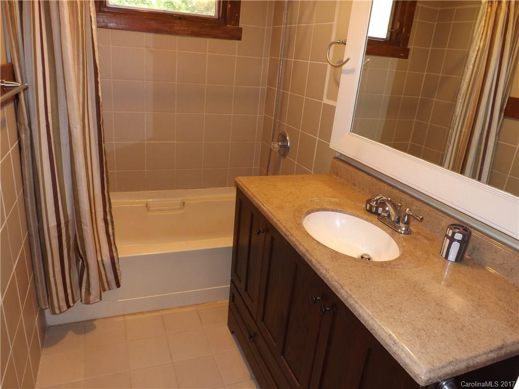 6019 Davis Road Waxhaw, NC 28173 - Photo 14 of 19 a bathroom with a sink and a mirror